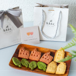 伴手禮贈(zèng)送『迦南園烘焙庇護(hù)工場』的公益餅乾，可愛、溫馨兼顧著美味，為這場活動(dòng)增添一份愛的溫度。